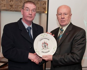 Adrian Gallagher presenting the Gallagher Clan plate to the Canadian Ambassador