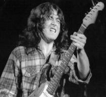 Rory Gallagher performing live Irish blues rock guitarist